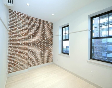 459 W 43rd St - Photo Thumbnail 2