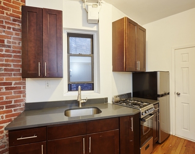 437 W 46th St - Photo Thumbnail 1