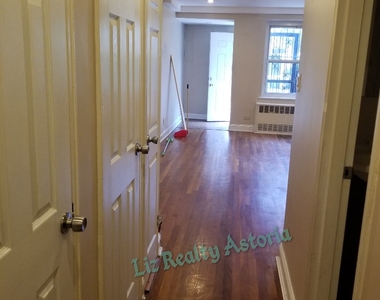 2 bedroom apt ( junior 4) with back yard and parking additional in Woodside - Photo Thumbnail 1