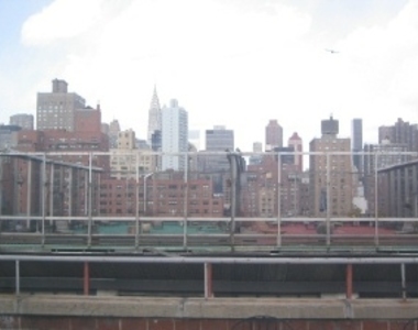 East 24th Street - Photo Thumbnail 2