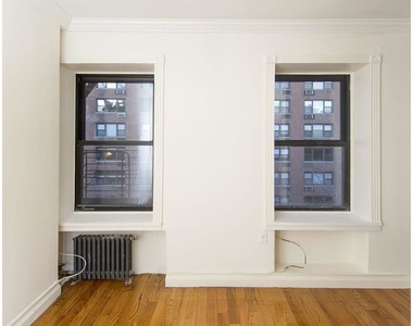 338 East 55th St - Photo Thumbnail 2