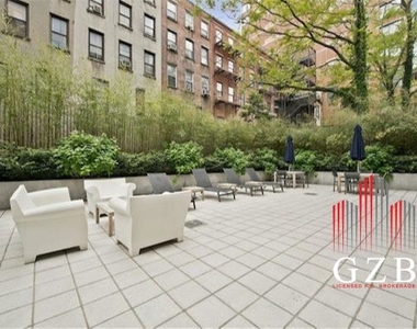 W 58th St, - Photo Thumbnail 3