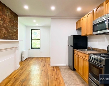 413 E 9th Street - Photo Thumbnail 1