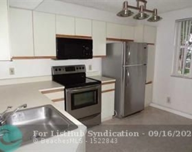 8781 Wiles Rd - Photo Thumbnail 1