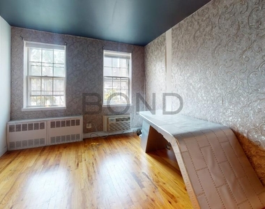 402 E 83rd - Photo Thumbnail 1