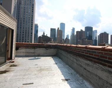 312 West 48th Street - Photo Thumbnail 0