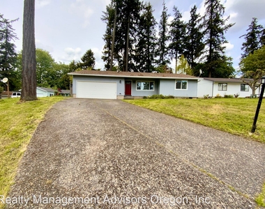 989 Se Fir Grove Loop - Photo Thumbnail 0