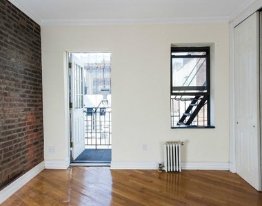 East 10th Street, Unit 13 - Photo Thumbnail 3