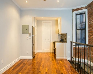 214 East 25th Street - Photo Thumbnail 2