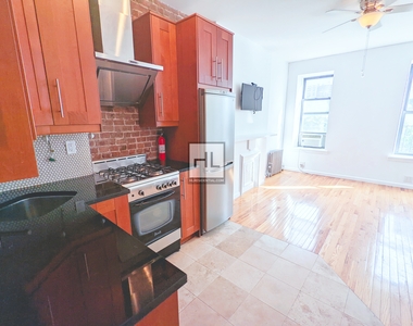 433 West 46 Street - Photo Thumbnail 0