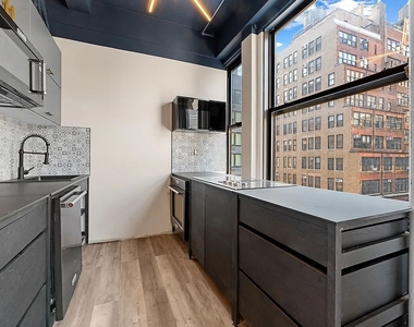 214 West 30th Street - Photo Thumbnail 6