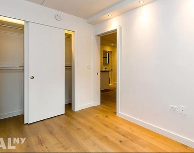 DIMES SQ/LES 2 BED 2 BATH!!! STEAL OF A DEAL!!! DOORMAN BUILDING AND NO FEE :) - Photo Thumbnail 5