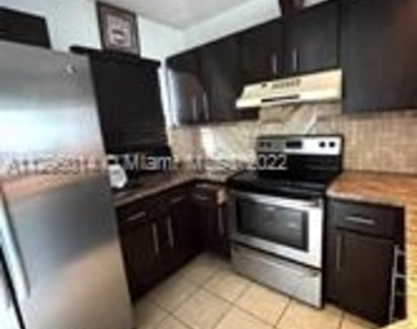 8750 N Sherman Cir - Photo Thumbnail 3