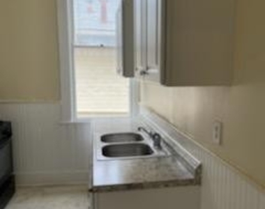 1138 W Ashby Pl - Photo Thumbnail 2