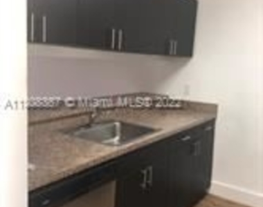 8720 N Sherman Cir - Photo Thumbnail 1