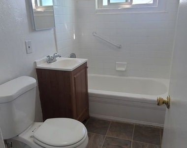 10107 South Hoover Street - Photo Thumbnail 6