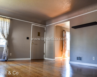 6725 N Delaware Ave - Photo Thumbnail 3