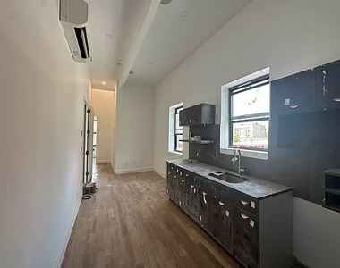 104 Graham Ave, Brooklyn, NY 11206 - Photo Thumbnail 1