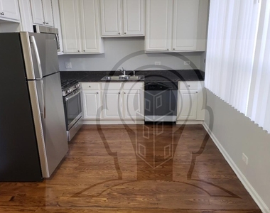2451 W Howard St - Photo Thumbnail 1