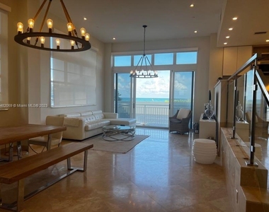 6917 Collins Ave - Photo Thumbnail 3