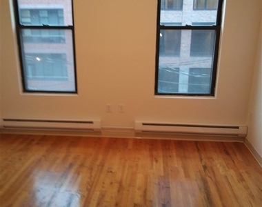 1409 Grand St - Photo Thumbnail 1