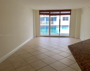 6917 Collins Ave - Photo Thumbnail 1