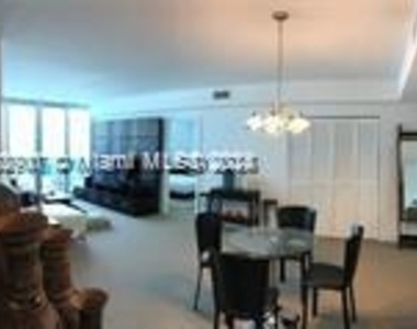 7501 E Treasure Dr - Photo Thumbnail 1