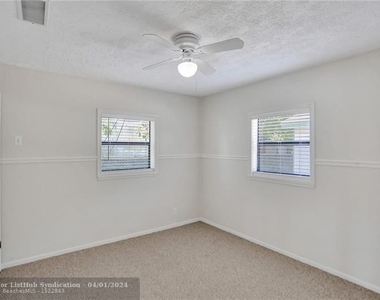 450 Ne 58th Ct - Photo Thumbnail 3