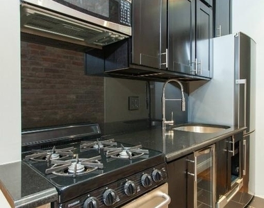 E 18th St. - Photo Thumbnail 4