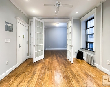 E 18th St. - Photo Thumbnail 7