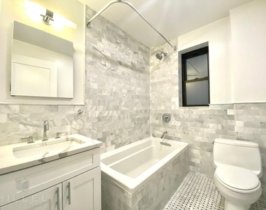 E 48th St - Photo Thumbnail 7