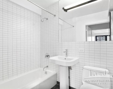 E 39th St - Photo Thumbnail 5