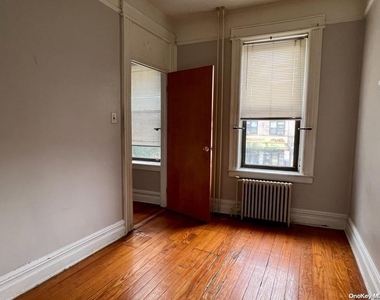 65-03 Fresh Pond Road - Photo Thumbnail 2