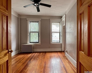 65-03 Fresh Pond Road - Photo Thumbnail 1