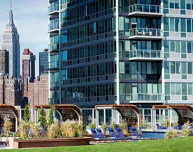 4545 Center BoulevardStunning 1 bed apartment featuring a home office area and private balcony with partial views of the East River. This home also features a spacious living area, open kitchen, ample closet space, and southern exposure. - Photo Thumbnail 8