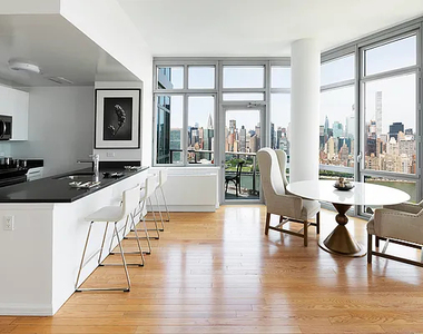4545 Center BoulevardStunning 1 bed apartment featuring a home office area and private balcony with partial views of the East River. This home also features a spacious living area, open kitchen, ample closet space, and southern exposure. - Photo Thumbnail 2