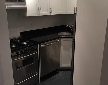 E 46th St - Photo Thumbnail 5