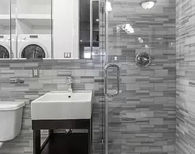 E 10th St - Photo Thumbnail 2