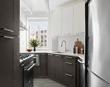 E 15TH ST - Photo Thumbnail 2