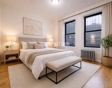 E 12TH ST - Photo Thumbnail 1