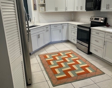 7048 Pelican Bay Boulevard - Photo Thumbnail 4