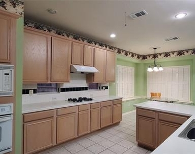 1003 Spring Tide Drive - Photo Thumbnail 1