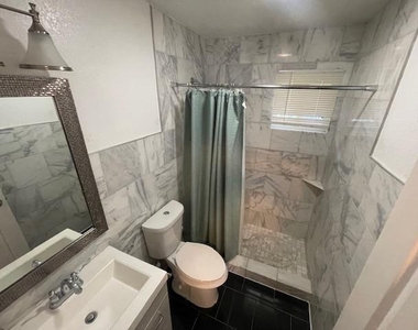 1113 E 3rd St - Photo Thumbnail 4