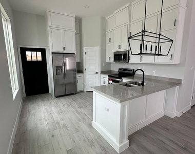 1409 S Xanthia Street - Photo Thumbnail 2