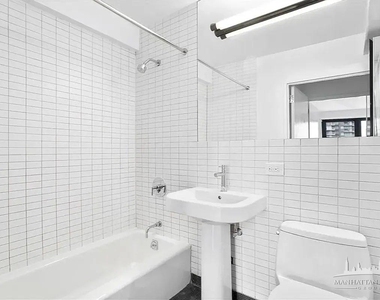 E 39th St - Photo Thumbnail 5
