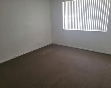 8741 Wiles Road - Photo Thumbnail 4