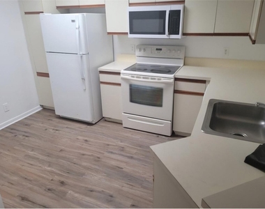 8741 Wiles Road - Photo Thumbnail 2