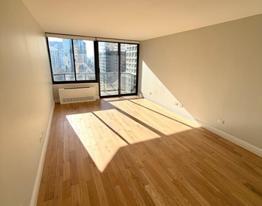 W 48th St - Photo Thumbnail 2