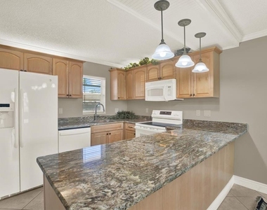 7625 Sun Island Drive S - Photo Thumbnail 10