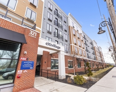 321 E 3rd St - Photo Thumbnail 1